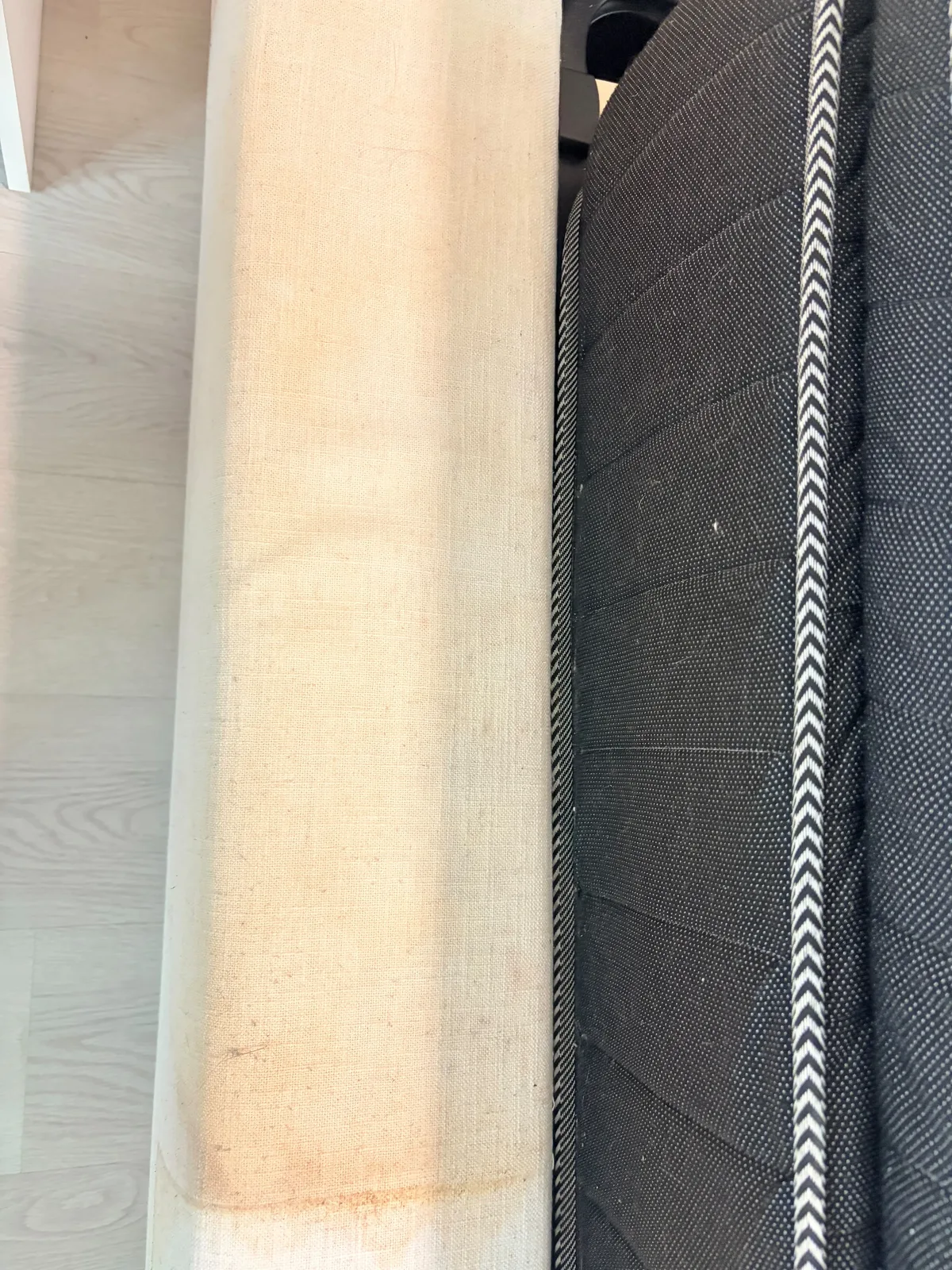 Mattress before deep cleaning — close-up of stained upholstered edge