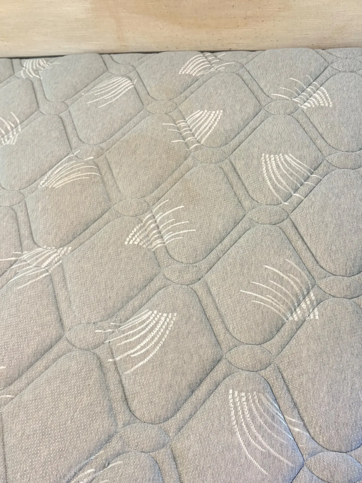 Mattress before deep cleaning — dust and marks across the surface