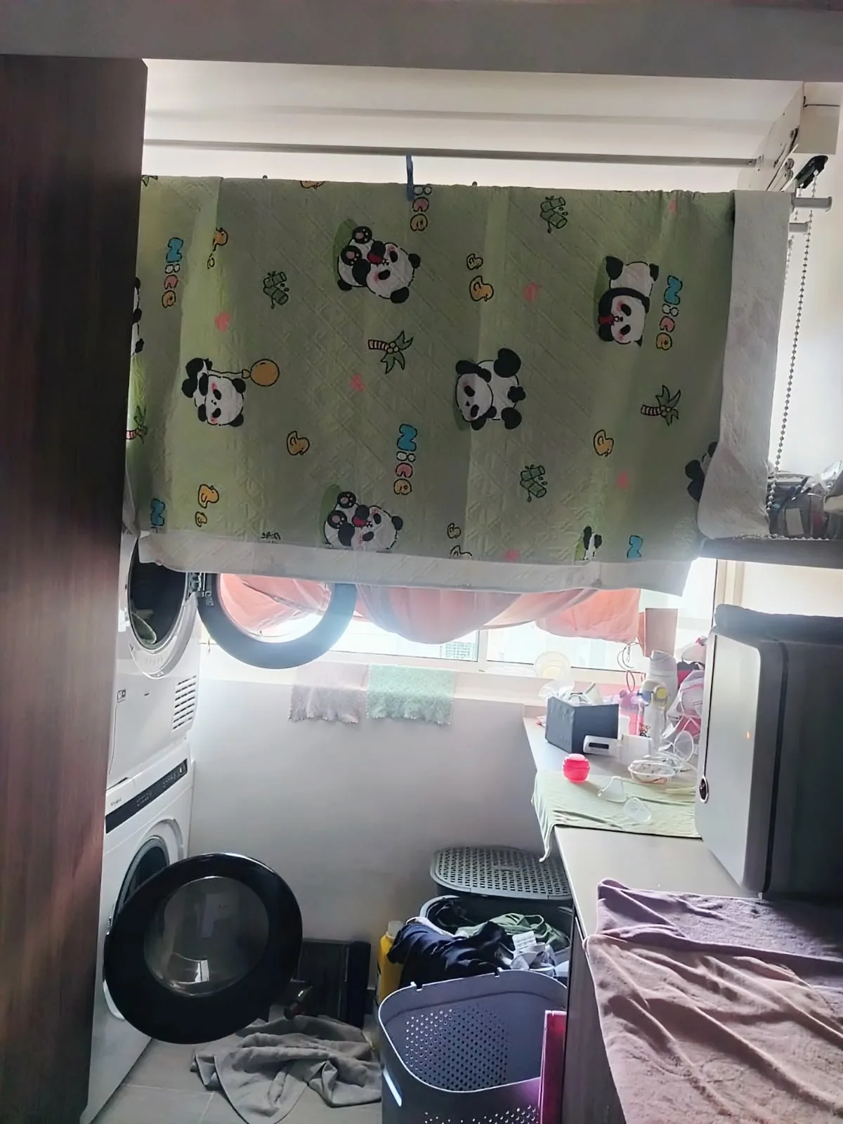 Live-out helper folding laundry
