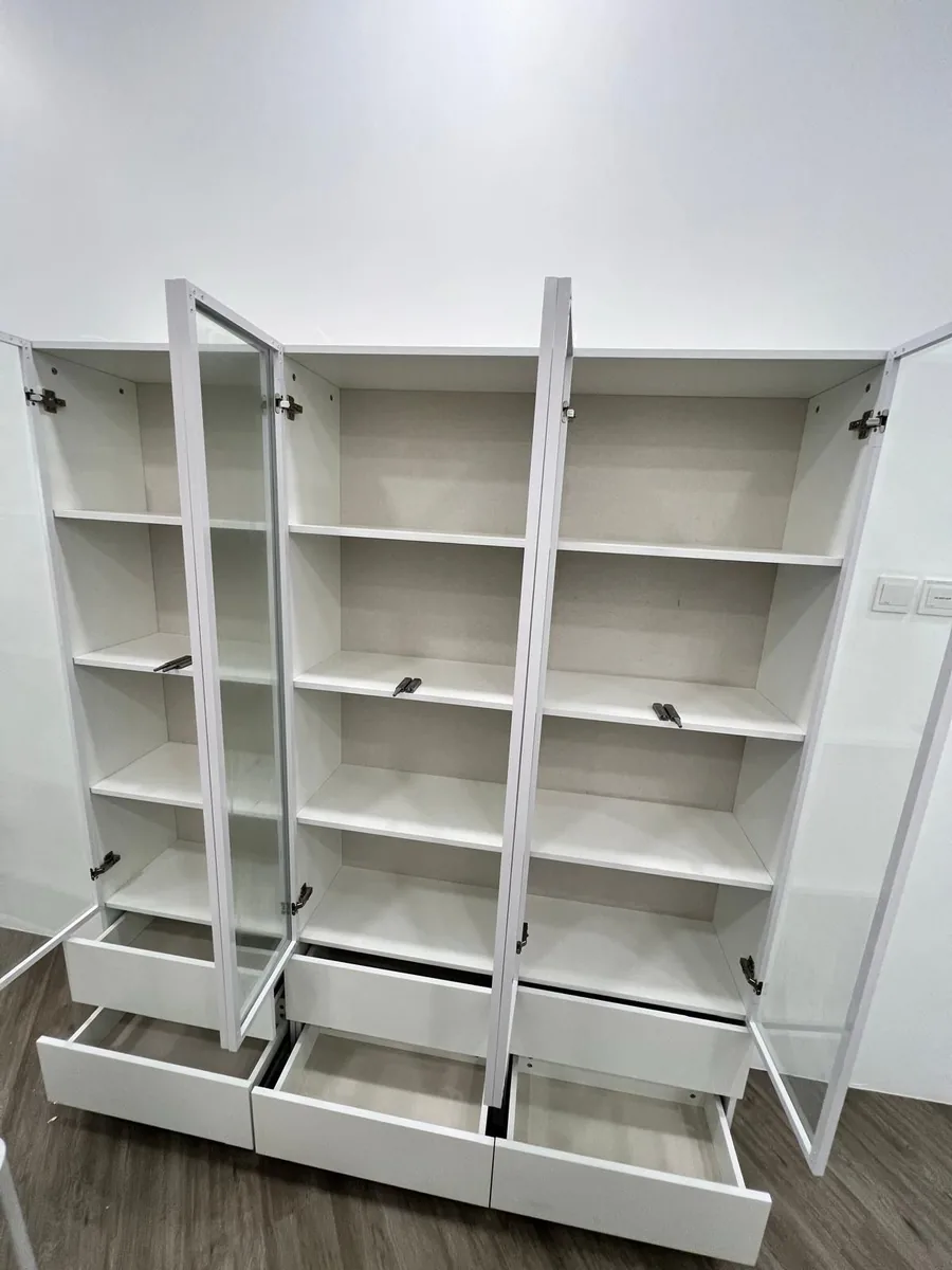 Full cabinet unit โ all doors and drawers opened, interiors wiped clean
