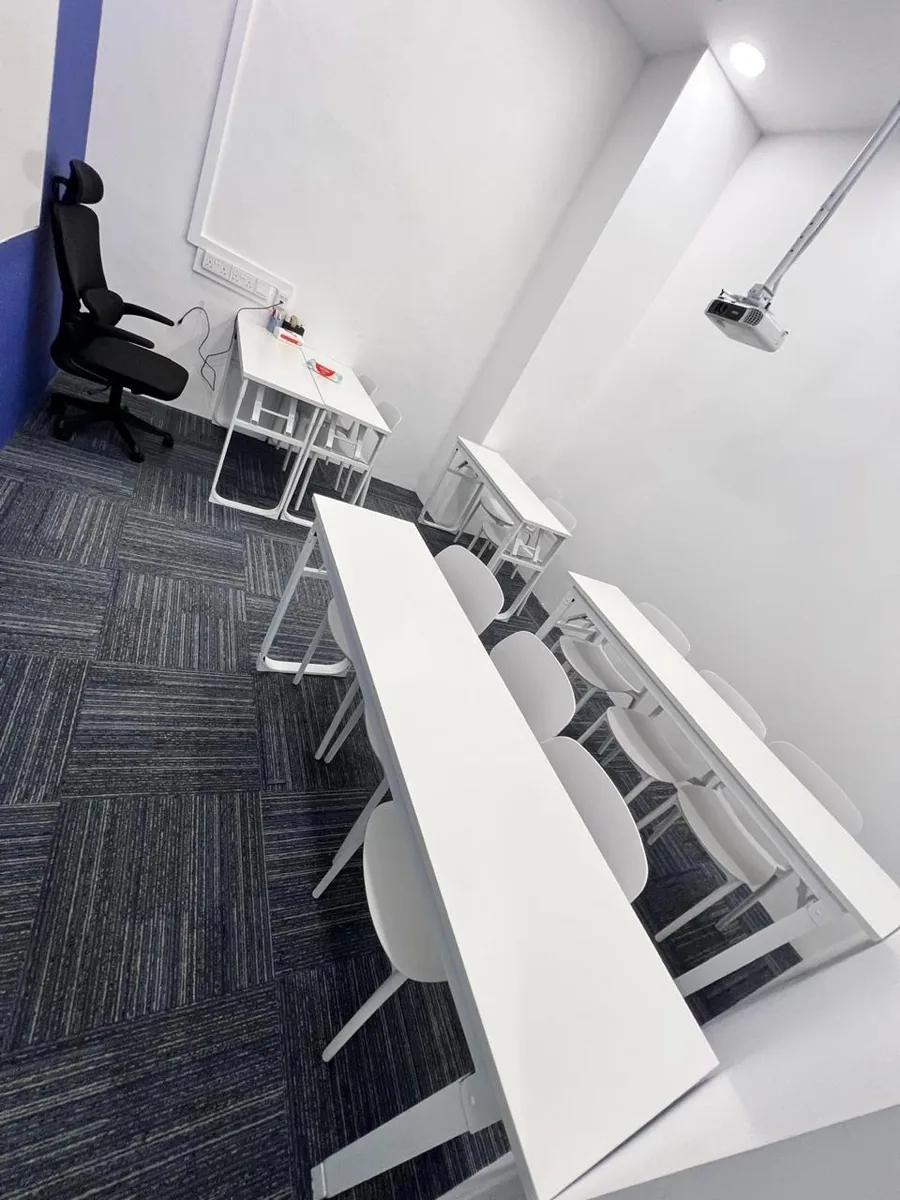 Clean training room with projector โ professional office clean result