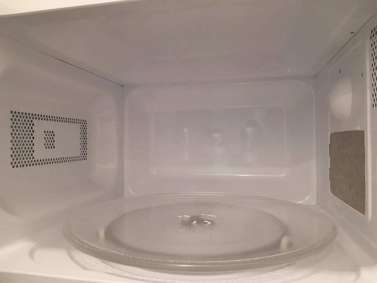 Office microwave after cleaning โ interior spotless