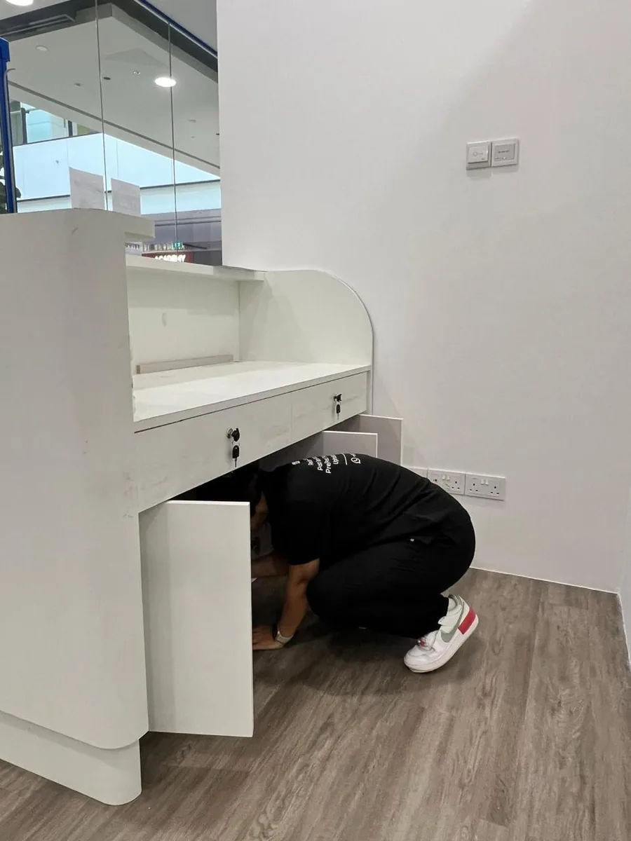 Reception desk deep clean โ under-counter and drawer areas