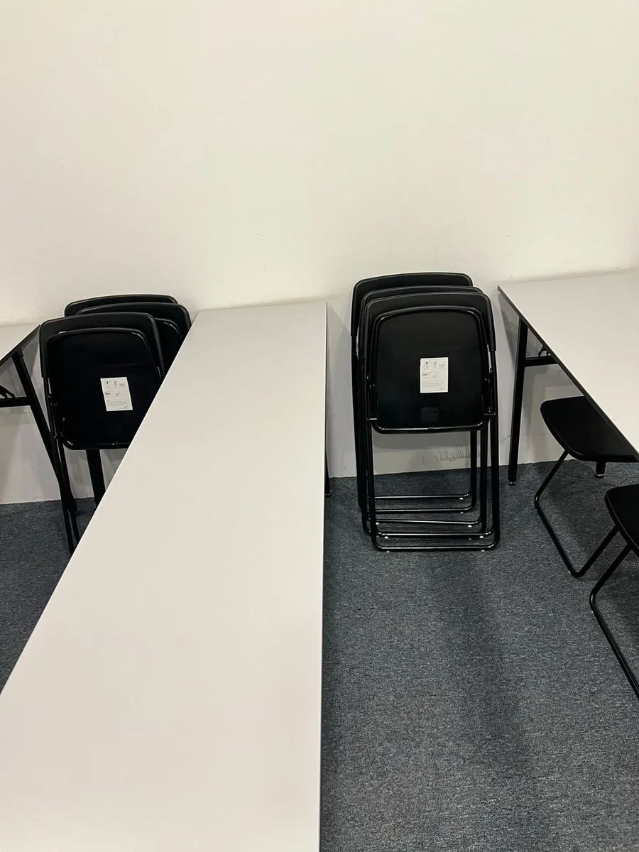 Training room โ chairs folded for floor cleaning access