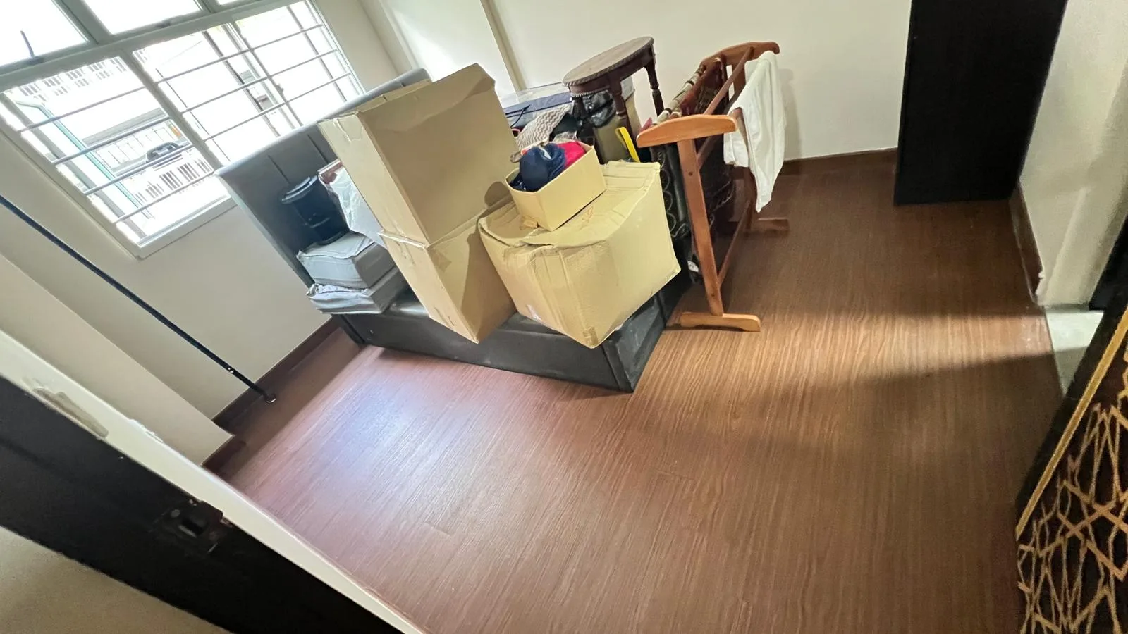 Bedroom after cleaning โ surfaces clean, floor polished