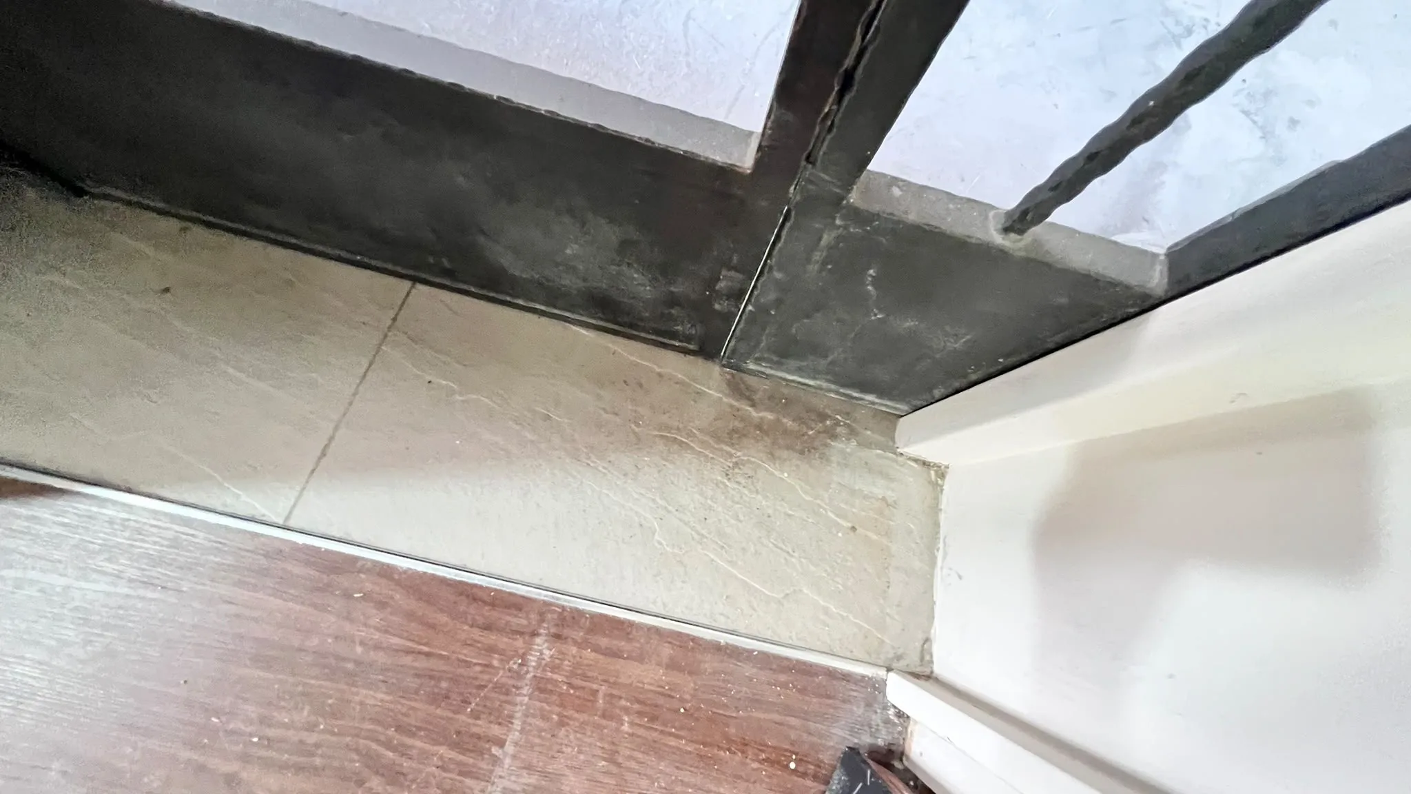 Entrance foyer before cleaning โ renovation residue throughout