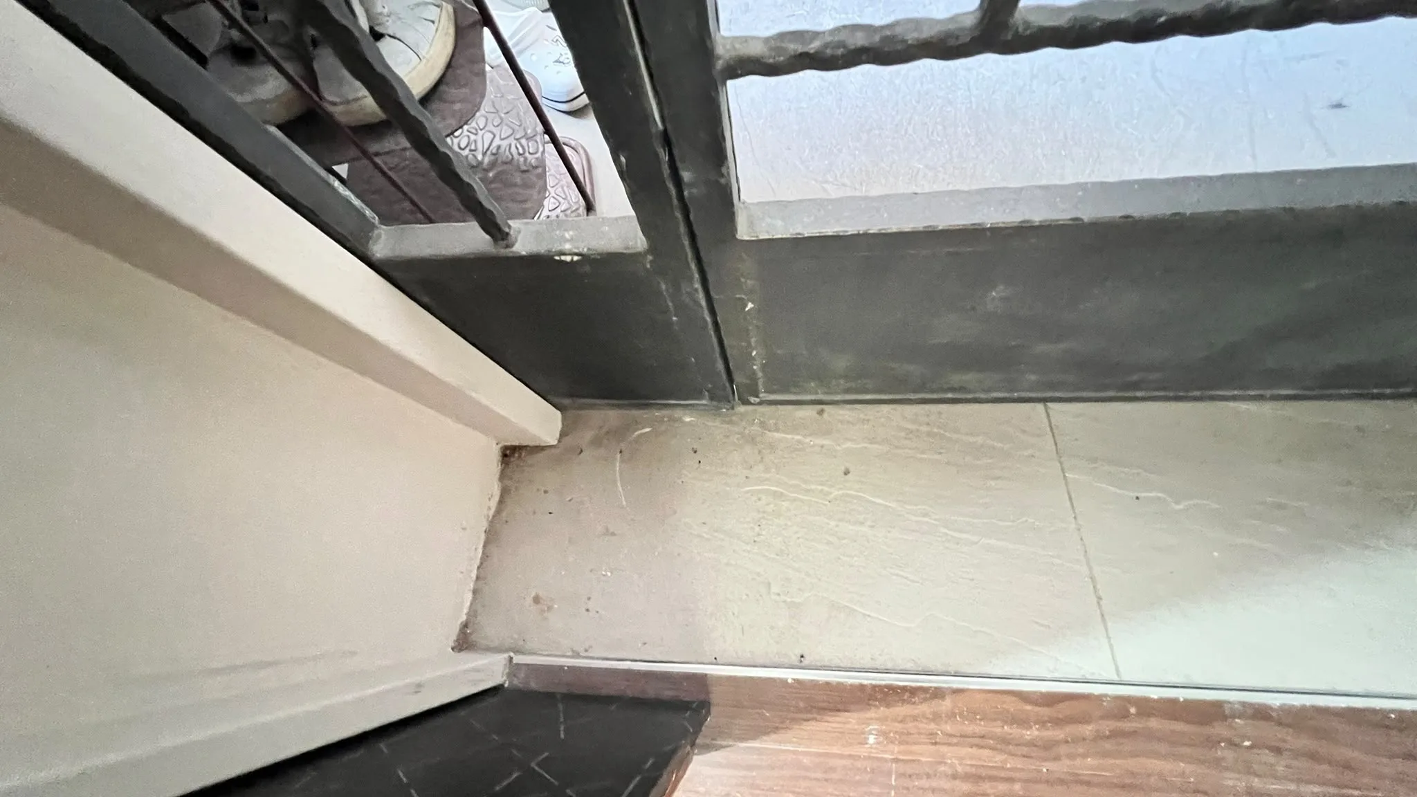 Entrance area before cleaning โ contractor dust on surfaces