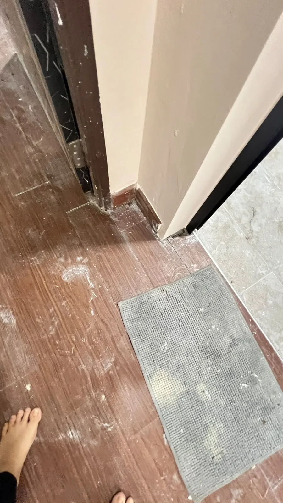 Flooring before cleaning โ renovation haze across tiles