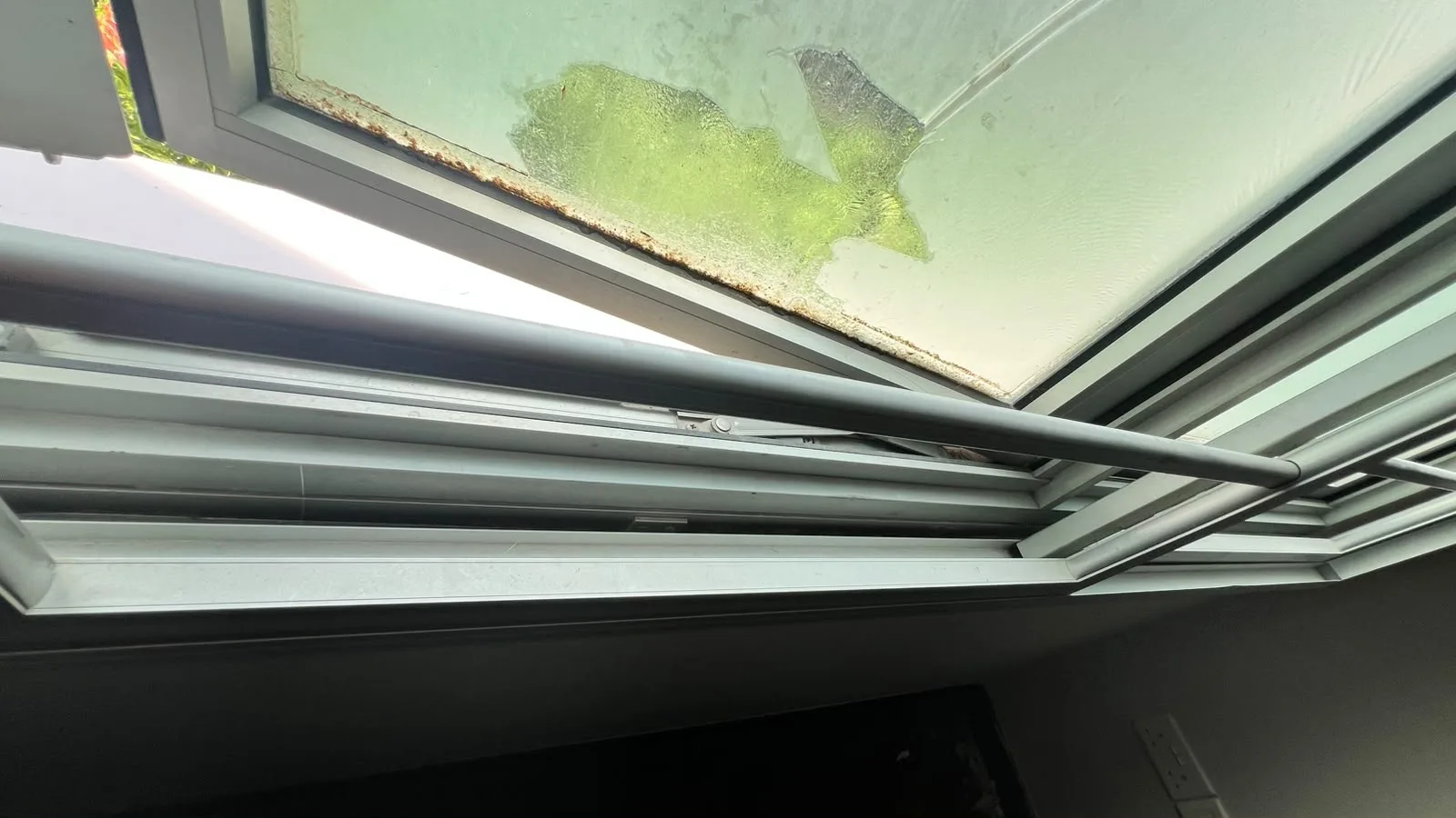 Windows before cleaning โ post-reno residue on glass