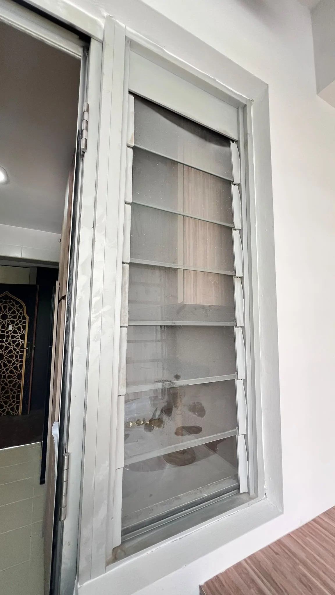 Windows before cleaning โ renovation dust on frames and panes